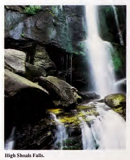 Image of exposed granite face of High Shoals Falls (Burke County, N.C.).  From the <i>Geologic Guide to North Carolina's State Parks</i>, published 1989 by the North Carolina Geological Survey.  Presented on NC Digital Collections. 