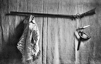 Daniel Boone's rifle, hunting shirt, knife, powder horn and tomahawk. Image from the North Carolina Museum of History.