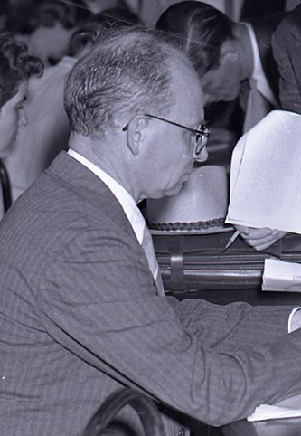 Prof. Holton Holland assisting with summer school registration at Duke University, June 12, 1939. Image from the Duke University Archives.