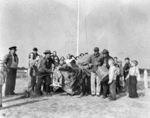 A rider tumbles off “Old Buck” during an Old Christmas celebration at Rodanthe in the 1950s. Photograph by Ben Dixon MacNeill. North Carolina Collection, University of North Carolina at Chapel Hill Library.