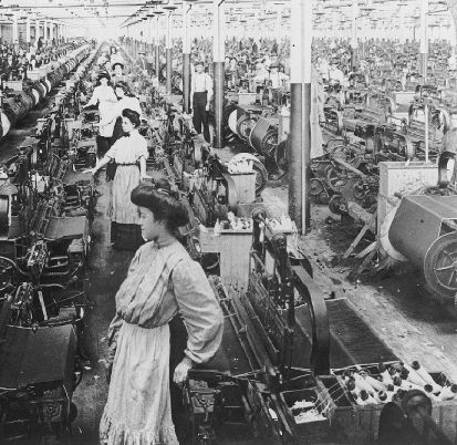 "Men and women weaving at the White Oak Mill in Greensboro, NC, 1909."